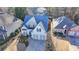 Stunning aerial view of a well-maintained home with a beautifully landscaped yard and charming curb appeal at 3355 Olivia Ct, Cumming, GA 30041