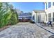 Beautiful backyard patio with stone pavers and elegant outdoor seating, perfect for entertaining at 3355 Olivia Ct, Cumming, GA 30041