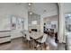 Spacious dining room with modern decor, wood floors, a fireplace, and ample natural light perfect for gatherings at 3355 Olivia Ct, Cumming, GA 30041