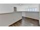 Hallway featuring wood floors and neutral walls in a bright, open space at 3355 Olivia Ct, Cumming, GA 30041