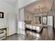 A bedroom with an attached sitting room, hardwood floors, tray ceilings, and lots of sunlight at 3355 Olivia Ct, Cumming, GA 30041