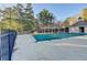 The neighborhood swimming pool with an expansive deck area and covered gazebos at 3355 Olivia Ct, Cumming, GA 30041