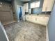 Modern bathroom featuring gray tile floors, a large shower with white tile, and a vanity with double sinks at 356 Greenwood Nw Dr, Lilburn, GA 30047