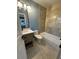 This bathroom features a tub, toilet, and new vanity at 356 Greenwood Nw Dr, Lilburn, GA 30047