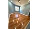 This bedroom features hardwood floors, neutral paint, a ceiling fan, and a window at 356 Greenwood Nw Dr, Lilburn, GA 30047