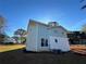 Charming two-story home featuring light blue siding and a white brick facade with a well-maintained lawn at 356 Greenwood Nw Dr, Lilburn, GA 30047