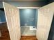 This laundry room features tile flooring, neutral paint, and washer/dryer hookups at 356 Greenwood Nw Dr, Lilburn, GA 30047