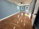 Spacious living room with hardwood floors, blue walls, and natural light from windows and a glass door at 356 Greenwood Nw Dr, Lilburn, GA 30047