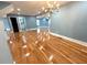 This living room features hardwood floors, neutral paint, recessed lighting, and chandelier at 356 Greenwood Nw Dr, Lilburn, GA 30047