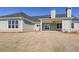 Backyard featuring a covered patio and lush lawn, perfect for outdoor entertaining at 5410 Crow Dr, Cumming, GA 30041