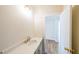 Bright half bathroom with single vanity, quartz countertops, and modern fixtures at 5410 Crow Dr, Cumming, GA 30041