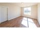 Well-lit bedroom featuring hardwood floors and neutral paint colors at 5410 Crow Dr, Cumming, GA 30041