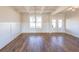 Bright dining room with hardwood floors, wainscoting, coffered ceiling, and modern pendant lighting at 5410 Crow Dr, Cumming, GA 30041