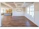 Elegant dining room with hardwood floors, coffered ceilings, and large windows at 5410 Crow Dr, Cumming, GA 30041