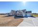 Beautiful single-Gathering home with a two-car garage, covered porch, and well-maintained landscaping at 5410 Crow Dr, Cumming, GA 30041