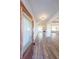 Welcoming foyer featuring hardwood floors, recessed lighting, and an open layout to the living spaces at 5410 Crow Dr, Cumming, GA 30041