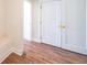 Hallway featuring white doors, hardwood floors and white trim at 5410 Crow Dr, Cumming, GA 30041