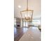 Contemporary kitchen island with quartz countertop, pendant lighting, and stainless-steel appliances at 5410 Crow Dr, Cumming, GA 30041