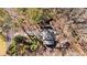 An aerial view showcases the property's roof, surrounding trees, and landscape at 181 Arrowood Ln, Alpharetta, GA 30009