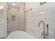 Close-up of a luxurious bathroom featuring a modern shower, stylish fixtures, and a soaking tub at 181 Arrowood Ln, Alpharetta, GA 30009