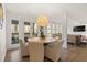 Cozy dining area featuring a round table, comfortable chairs, and access to the outdoor deck at 181 Arrowood Ln, Alpharetta, GA 30009