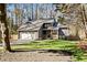 A charming home with a well-manicured lawn, two-car garage, and inviting front porch at 181 Arrowood Ln, Alpharetta, GA 30009