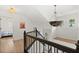 Bright hallway with hardwood floors, modern lighting, and a view into the bedroom at 181 Arrowood Ln, Alpharetta, GA 30009