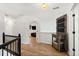 Upstairs hallway with hardwood floors leading to various rooms, and a decorative chalkboard at 181 Arrowood Ln, Alpharetta, GA 30009