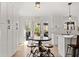 Kitchen with breakfast nook and french doors leading to a deck and an outdoor grill at 181 Arrowood Ln, Alpharetta, GA 30009