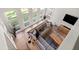 Comfortable living room with a large window, stylish furniture, and hardwood floors at 181 Arrowood Ln, Alpharetta, GA 30009