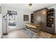 Home office with desk, a large window, and built-in storage solutions at 181 Arrowood Ln, Alpharetta, GA 30009