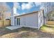 The backyard features a patio area and a newly constructed wooden fence for privacy at 6042 Creekford Dr, Lithonia, GA 30058