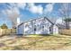 View of fenced-in backyard with nice lawn and a patio area at 6042 Creekford Dr, Lithonia, GA 30058