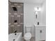 Elegant bathroom boasts gray-toned tile, contemporary vanity, and modern fixtures at 6042 Creekford Dr, Lithonia, GA 30058