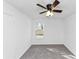 Bright bedroom with a ceiling fan and neutral carpeting at 6042 Creekford Dr, Lithonia, GA 30058