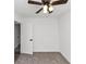 Well-lit bedroom with neutral carpet and ceiling fan at 6042 Creekford Dr, Lithonia, GA 30058