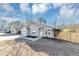 Charming one-story home featuring gray siding, a well-manicured yard, and a concrete driveway at 6042 Creekford Dr, Lithonia, GA 30058
