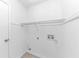 Functional laundry area with shelving and connections for laundry appliances at 6042 Creekford Dr, Lithonia, GA 30058