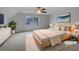 Cozy staged bedroom featuring soft carpet, a large window, and neutral decor at 641 Morningside Dr, Stockbridge, GA 30281