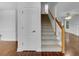 Inviting entryway with hardwood floors, a carpeted staircase, and natural light at 641 Morningside Dr, Stockbridge, GA 30281