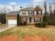 Charming two-story brick home featuring an attached garage and well-maintained landscaping at 641 Morningside Dr, Stockbridge, GA 30281