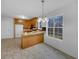 Eat-in kitchen featuring a breakfast bar, wooden cabinets, granite countertops, and stainless steel appliances at 641 Morningside Dr, Stockbridge, GA 30281