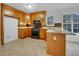 Functional kitchen featuring wood cabinets, stainless steel appliances, and tile backsplash at 641 Morningside Dr, Stockbridge, GA 30281