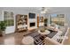 Bright living room boasts hardwood floors, fireplace, and built-in bookshelves at 641 Morningside Dr, Stockbridge, GA 30281