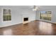An empty living room featuring hardwood floors and a fireplace at 641 Morningside Dr, Stockbridge, GA 30281