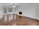 Bright living room featuring hardwood floors, a fireplace, and a door to the yard at 641 Morningside Dr, Stockbridge, GA 30281