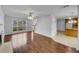 Bright living room with hardwood floors, a ceiling fan, and a large window offering plenty of natural light at 641 Morningside Dr, Stockbridge, GA 30281