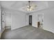 Spacious main bedroom with neutral carpet and multiple entryways to closet and bathroom at 641 Morningside Dr, Stockbridge, GA 30281
