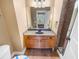 Bathroom features a single sink with cabinet, large mirror, and tiled floor at 789 Liberty Commons Nw Dr, Atlanta, GA 30314