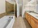 Bathroom with a tiled shower, soaking tub, and double vanity at 789 Liberty Commons Nw Dr, Atlanta, GA 30314
